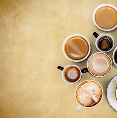 Coffee mugs on an old paper textured background
